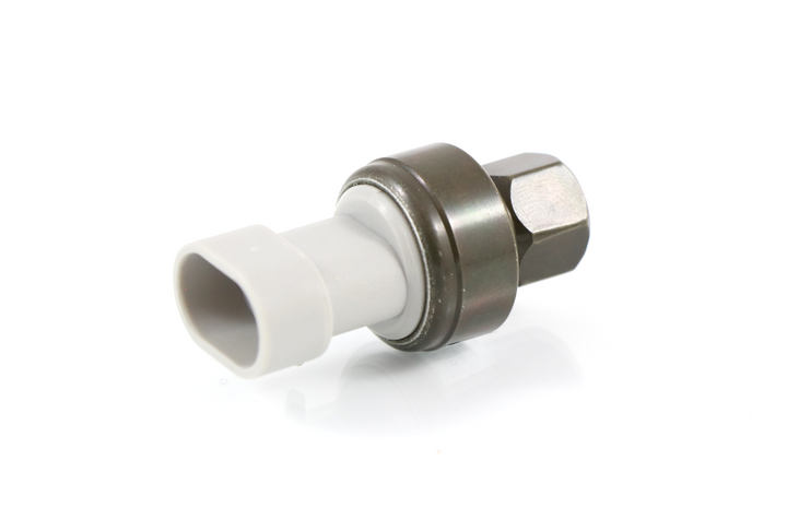 Advance Truck Parts USA K301-390-1 R134a refrigerant high pressure switch featuring M10 1.25 female metric threads, dark metal body, and light gray electrical connector housing