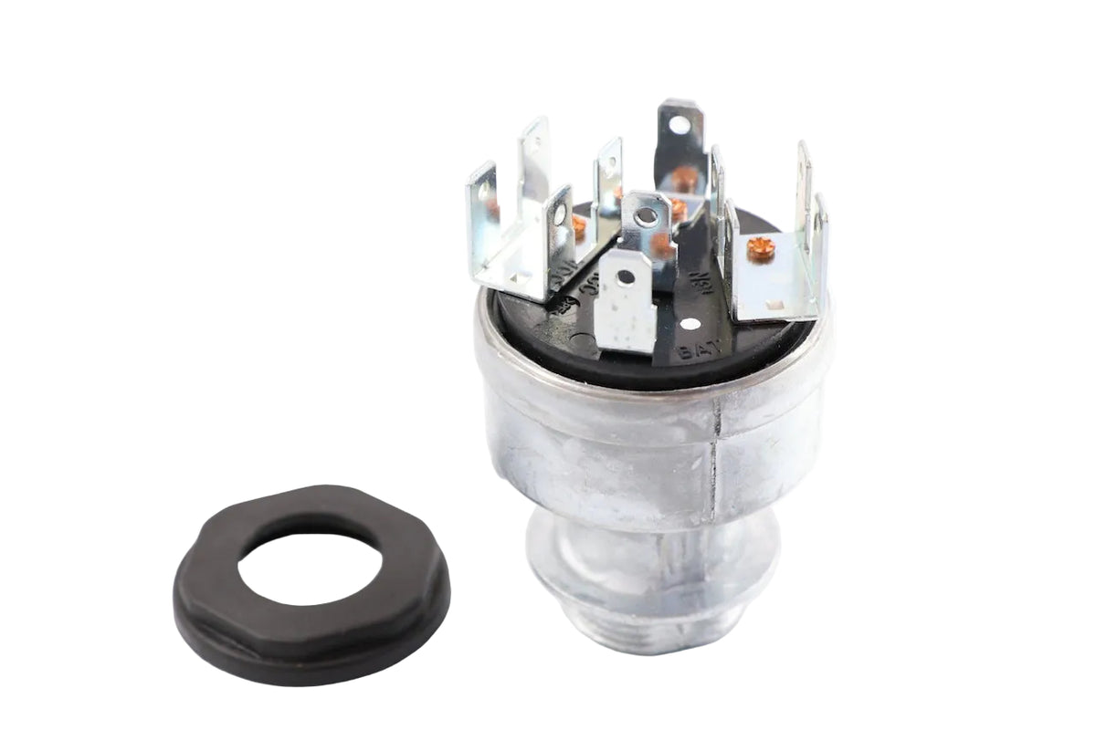 Advance Truck Parts USA W072012 Freightliner ignition switch showing a clean studio view of the metal cylindrical body, 11 terminal blades, and mounting nut 