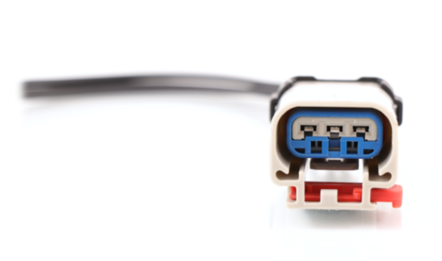 ATP W094135 3-pin pigtail harness connector showing a clean studio view of the female receptacle, blue seal, red locking tab, and attached wire lead 