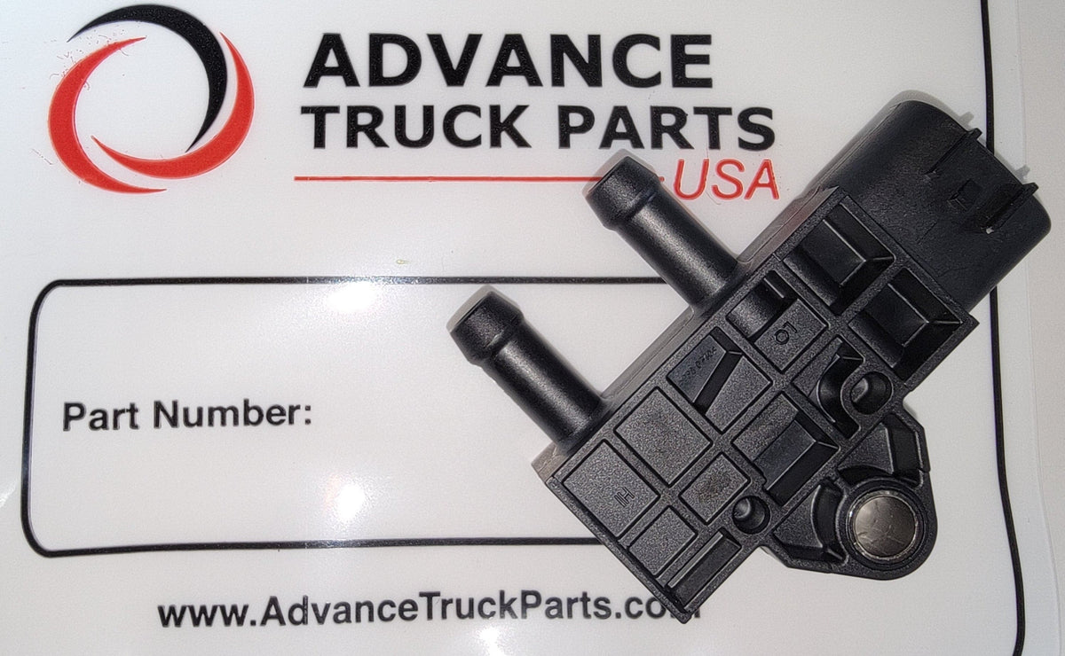 Advance Truck Parts USA 2894872 genuine Cummins differential pressure sensor displaying the black molded housing, dual inlet ports, and electrical connector terminal positioned over branded packaging