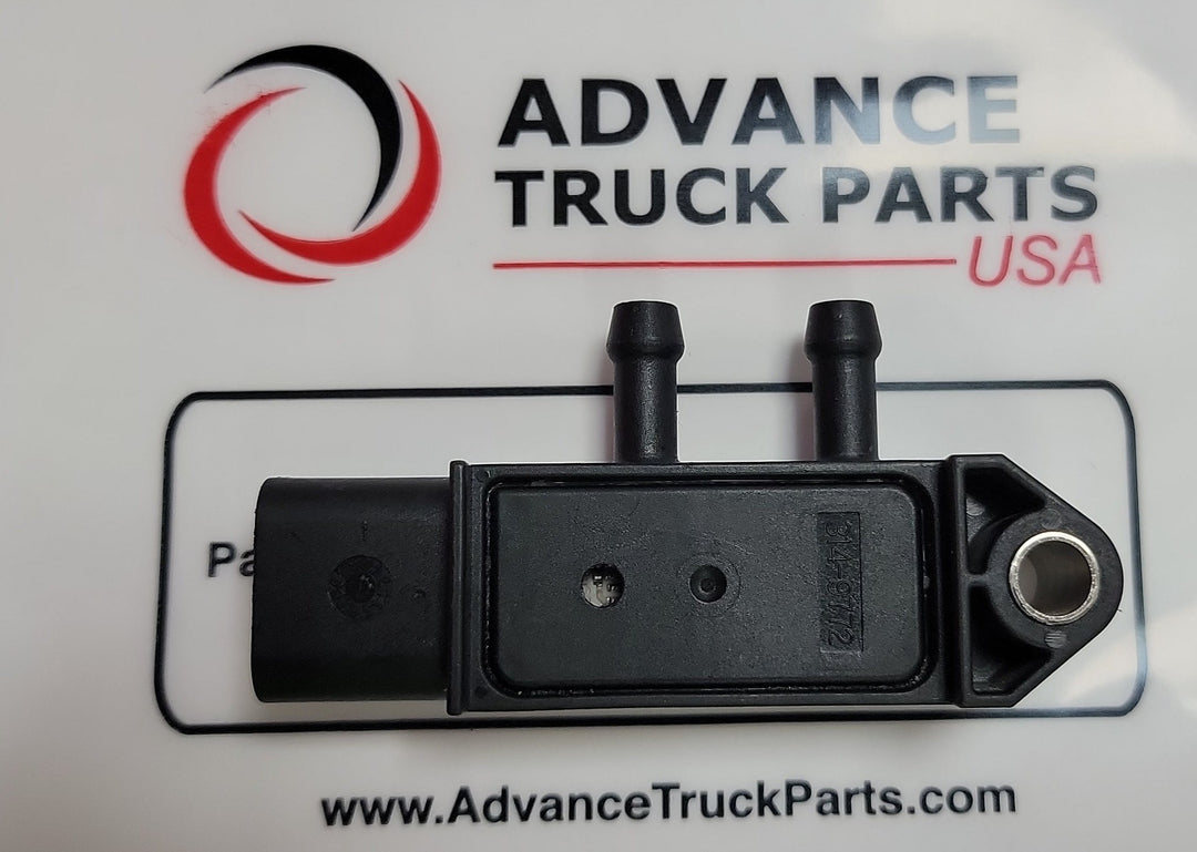 Advance Truck Parts USA 314-9772 Caterpillar DPF differential pressure sensor displaying the black molded housing, dual ports, and 3-pin connector layout over branded packaging