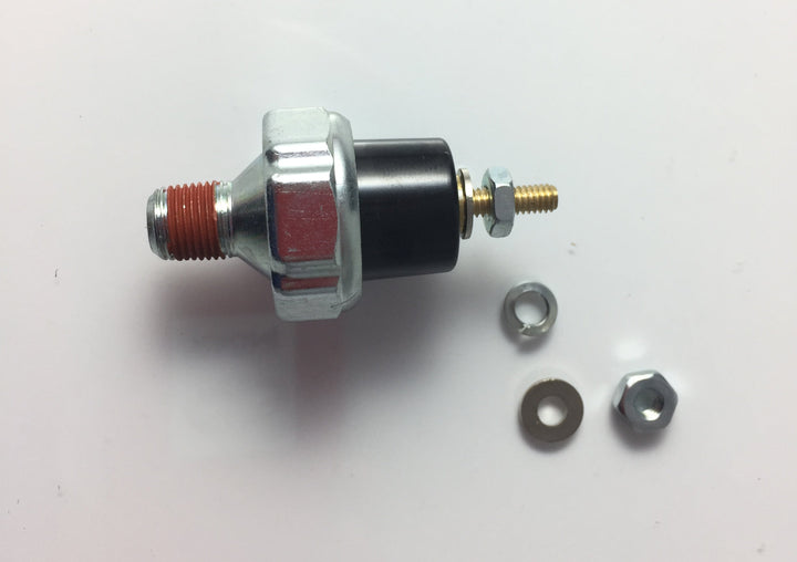 Advance Truck Parts USA 364K-F 15 PSI oil pressure switch showing a clean studio view of the threaded NPT fitting with red thread sealant, hex body, terminal post, and accompanying hardware washers on a plain white background