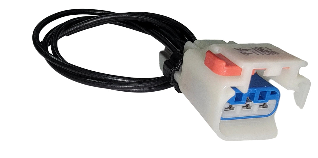 Advance Truck Parts 5299750 pigtail connector showing a clean studio view of the 3-blade terminal housing, red lock tab, and attached wire leads 