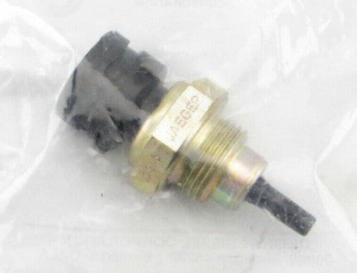 Advance Truck Parts USA A0125421017 Detroit Diesel engine oil temperature sensor showing the brass threaded body, black sensing probe, and black connector housing enclosed in clear plastic packaging