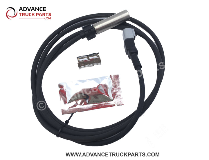 Advance Truck Parts USA branded studio flat lay perspective featuring the complete 78-inch ABS wheel speed sensor assembly alongside the included metal retaining clip and dielectric grease packet for reliable heavy-duty installation