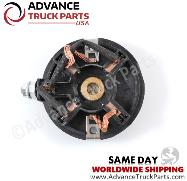 Advance Truck Parts USA studio top-down internal perspective showcasing the four copper brushes, braided wiring harness, central bearing, and black mounting housing of the replacement starter motor end cap for Briggs and Stratton engines