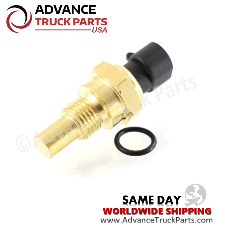 Advance Truck Parts USA branded studio angled perspective featuring the brass metallic body, threaded base section with installed black sealing O-ring, and extended black electrical receptacle of the Peterbilt and Kenworth temperature sensor