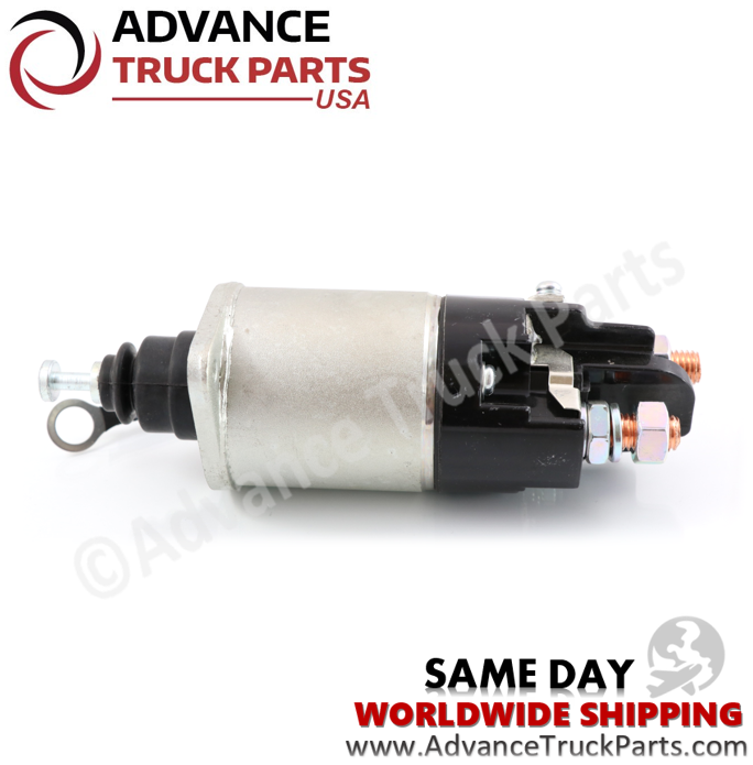 Advance Truck Parts USA branded studio horizontal perspective displaying the replacement commercial truck starter solenoid featuring the silver metallic housing, black contact cap, and spring-loaded plunger mechanism