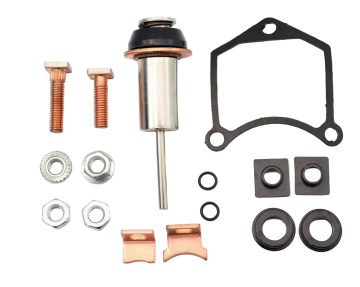 Advance Truck Parts USA Denso starter repair kit showing a clean studio view of the plunger, copper contacts, hardware bolts, nuts, O-rings, and solenoid gasket 
