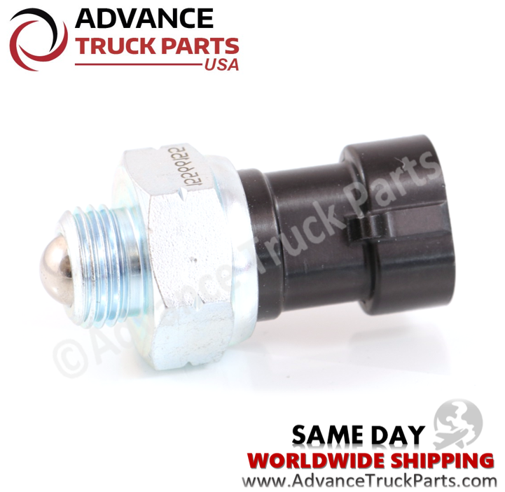 Advance Truck Parts USA branded studio horizontal profile perspective showcasing the metallic threaded ball switch end and black Packard Metri-Pack connector of the heavy-duty backup light switch for Freightliner commercial trucks