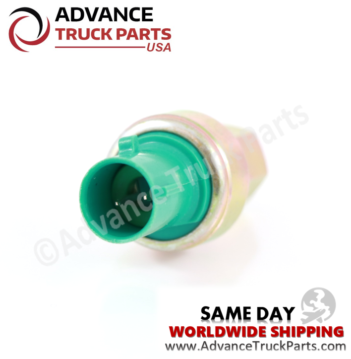 Advance Truck Parts USA branded studio angled perspective looking into the green connector housing and 2-pin layout of the heavy-duty high pressure A/C switch for commercial trucks