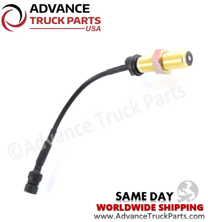 Advance Truck Parts USA studio angled perspective showcasing the heavy-duty engine speed sensor highlighting the flat magnetic sensing probe, brass threaded housing, and locking hex nut for Navistar commercial trucks