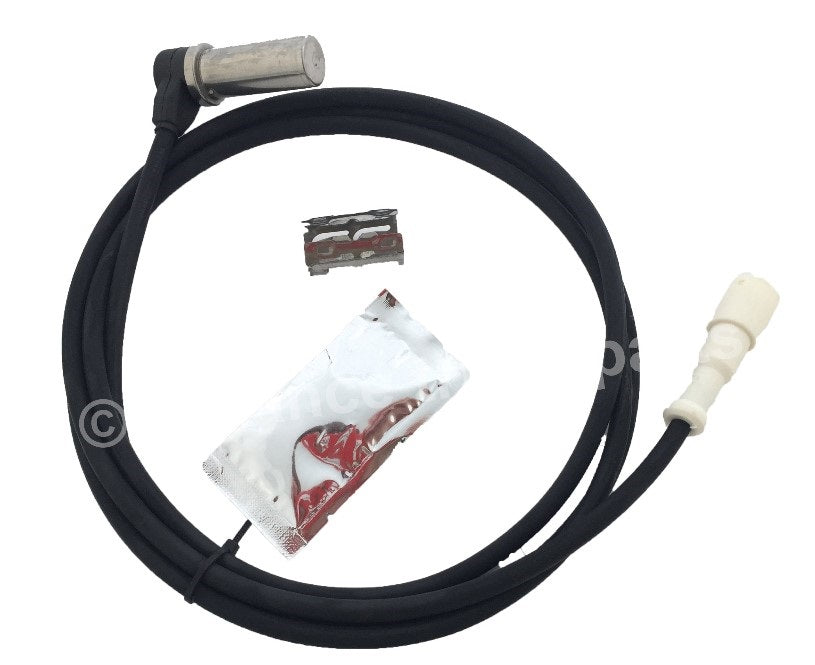 ATP K181265BXW replacement ABS wheel speed sensor assembly with dielectric grease and mounting clip on a plain background