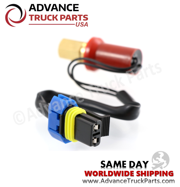 Advance Truck Parts USA branded studio angled perspective showcasing the heavy-duty high pressure switch highlighting the brass threaded fitting, red protective housing cover, and wired electrical connector for commercial truck AC systems
