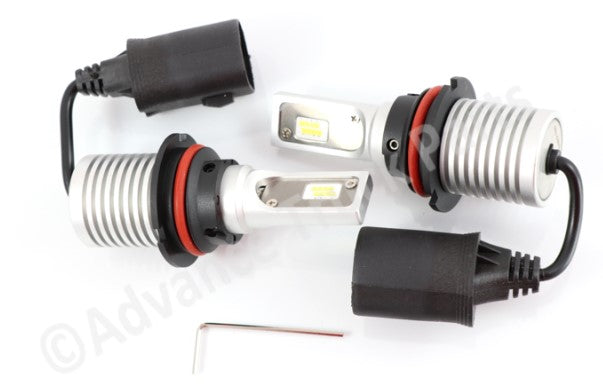 Advance Truck Parts USA 9004 LED headlight bulb set displayed with plug-in connectors and adjustment hardware tool