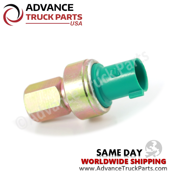 Advance Truck Parts USA branded studio left side angled perspective of the heavy-duty high pressure A/C switch highlighting the green connector housing for Navistar and International commercial trucks