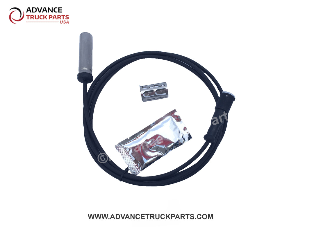 Advance Truck Parts USA branded studio view of the R955338 straight ABS sensor kit including sensor, cable, grease packet, and clip