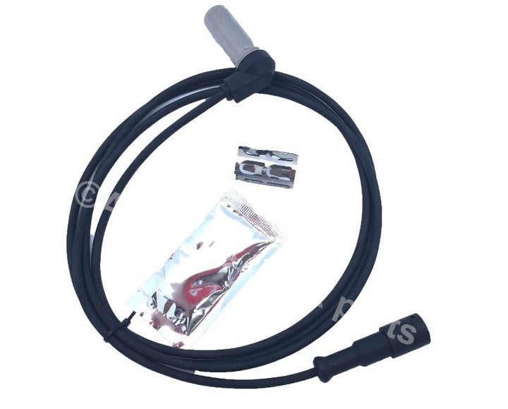 Advance Truck Parts USA right angle ABS sensor kit displaying the looped wire harness, metal sensor probe, installation clip, and grease pouch