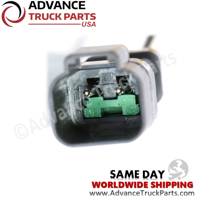 Advance Truck Parts USA Caterpillar speed sensor detail view of the 2-pin connector receptacle and green seal on a branded background