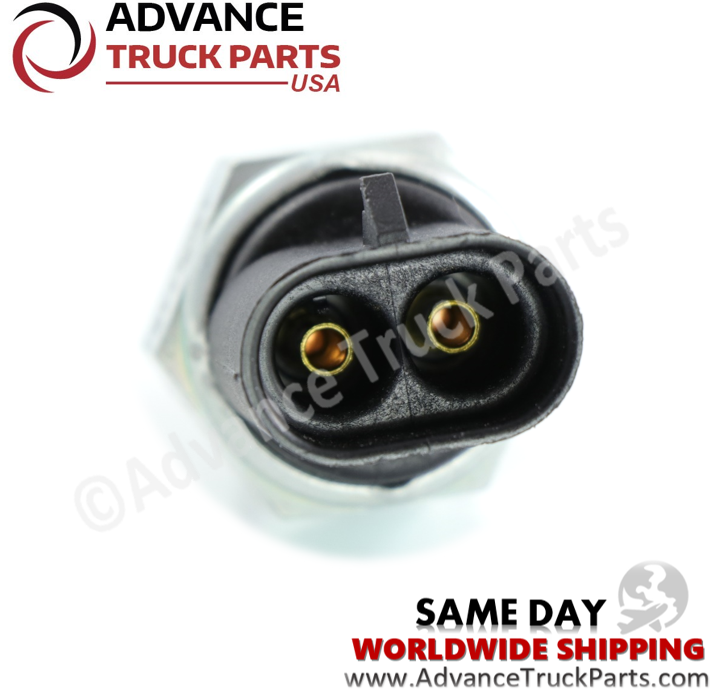 Advance Truck Parts USA branded studio close-up perspective highlighting the interior of the black plastic receptacle, revealing two recessed gold-plated connection pins on the replacement transmission switch