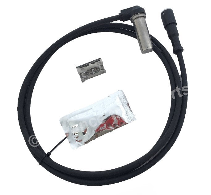 Advance Truck Parts USA S4410321850 right angle ABS sensor kit showing a clean studio perspective of the sensor probe, wiring harness, dielectric grease packet, and mounting clip