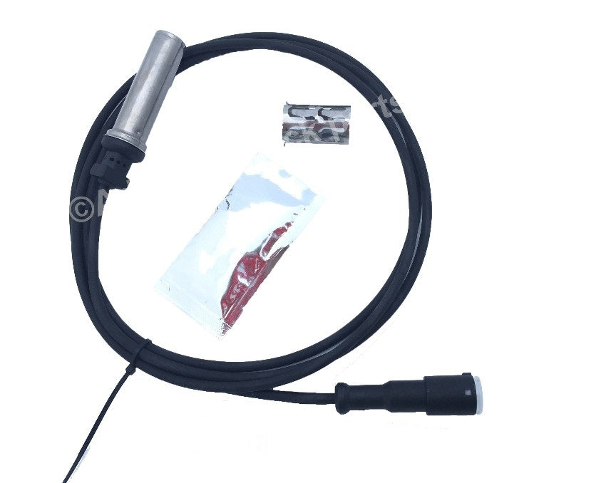 Advance Truck Parts USA S4497120180 1.8m ABS sensor cable showing a clean studio perspective of the straight sensor probe, wiring harness, dielectric grease packet, and retaining clip