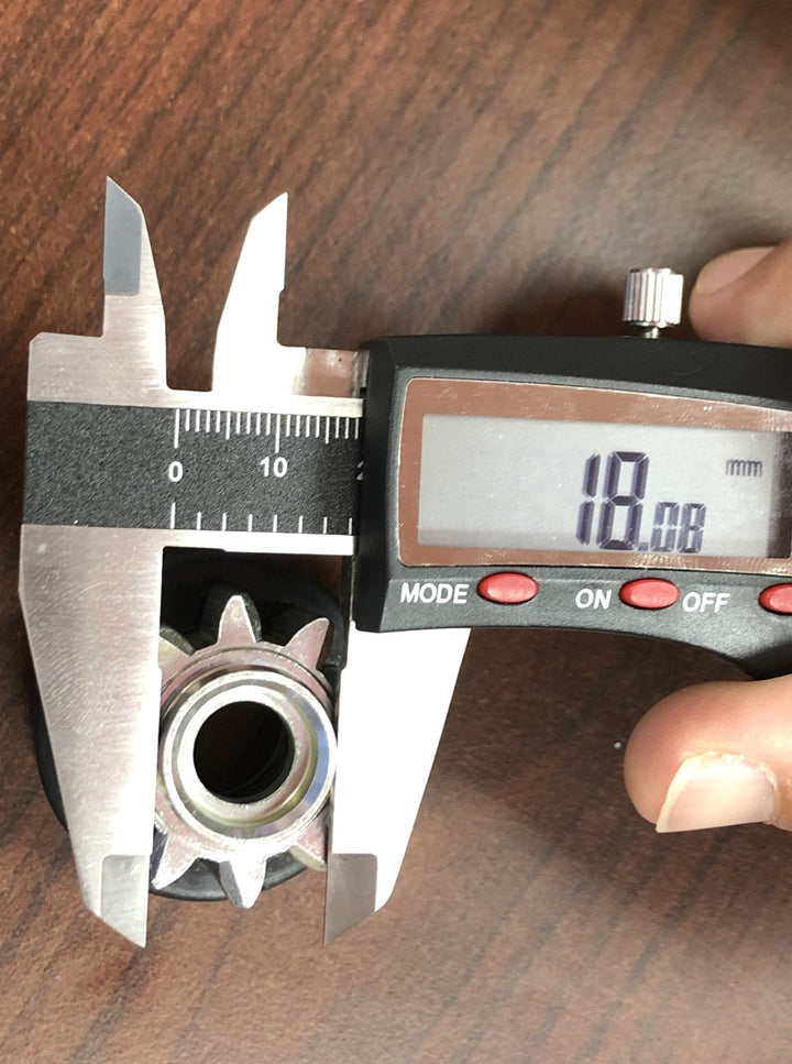 Digital caliper measuring dimensions of the starter drive bendix gear component